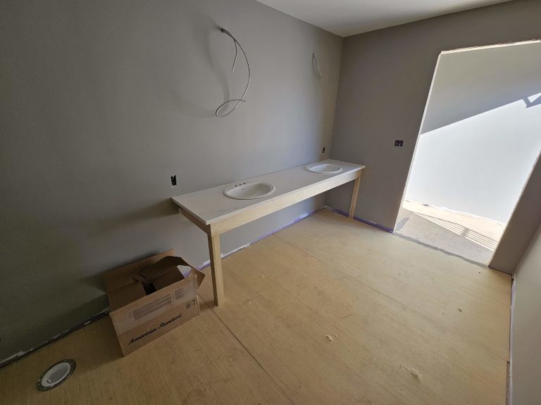 Lower level floor prep — leveling and subfloor work