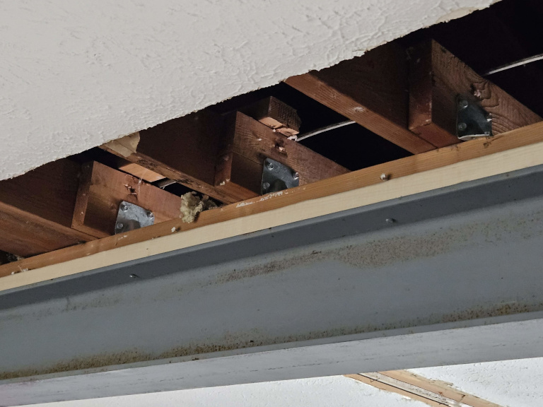 Joist hangers on installed I-beam