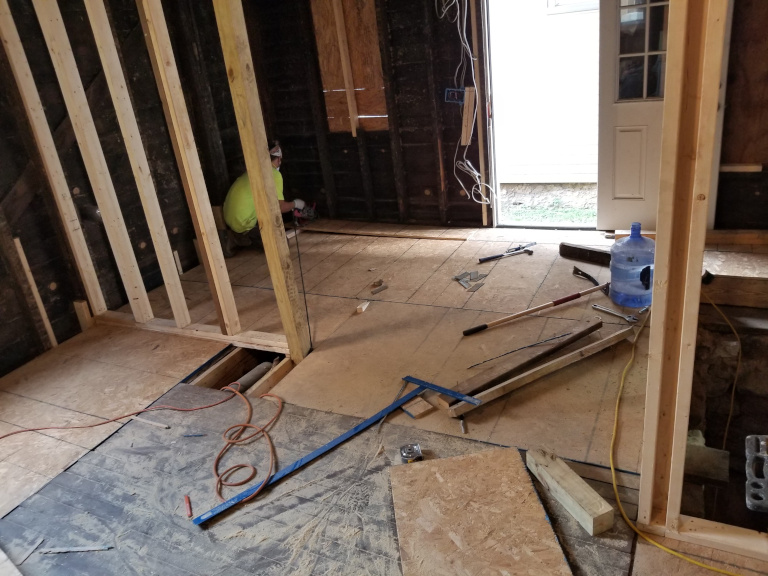 New subfloor and partition framing — first floor taking shape