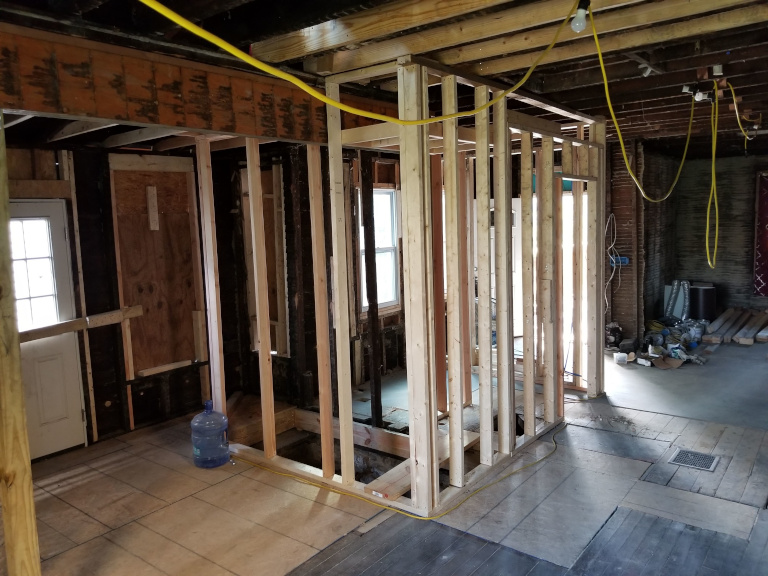 First floor framing complete — bathroom box framed in open plan